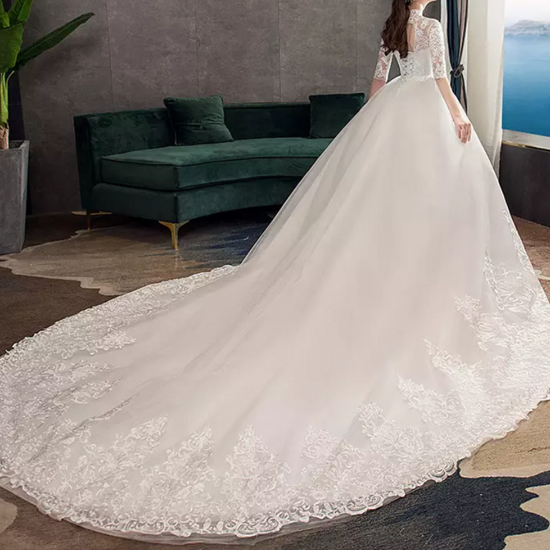 Three-Fourths Sleeve High Neck Sheer Lace Cathedral Train Wedding Dress